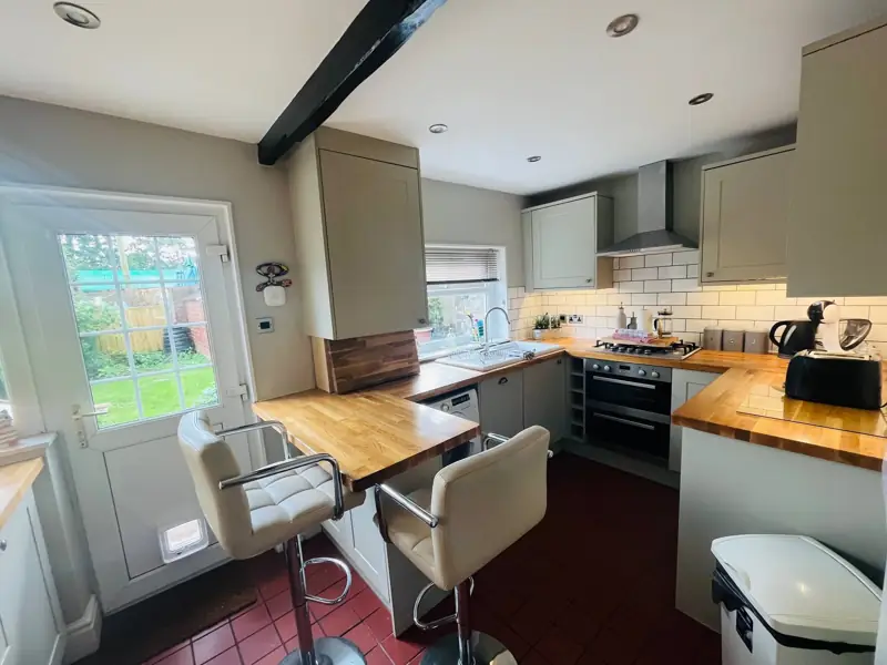 Kitchen with breakfast bar and garden door