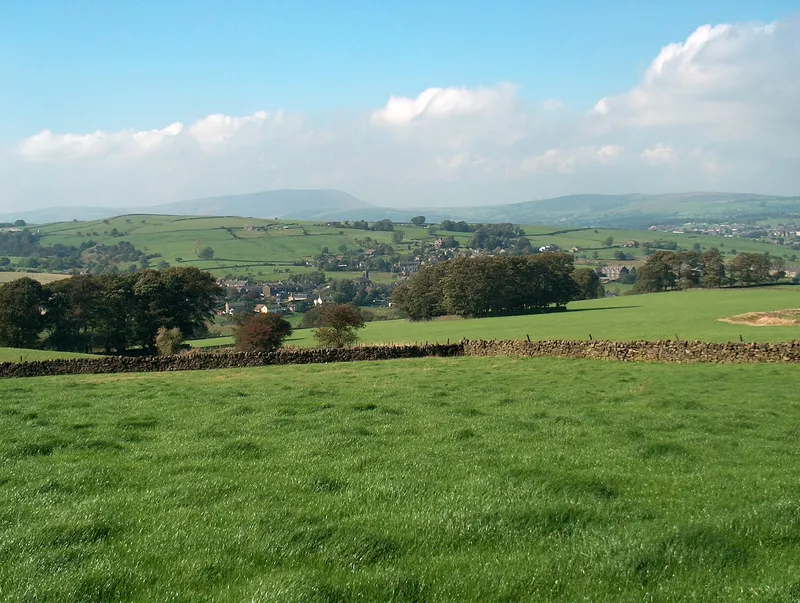 Green fields above Trawden with Pendle Hill on the skyline